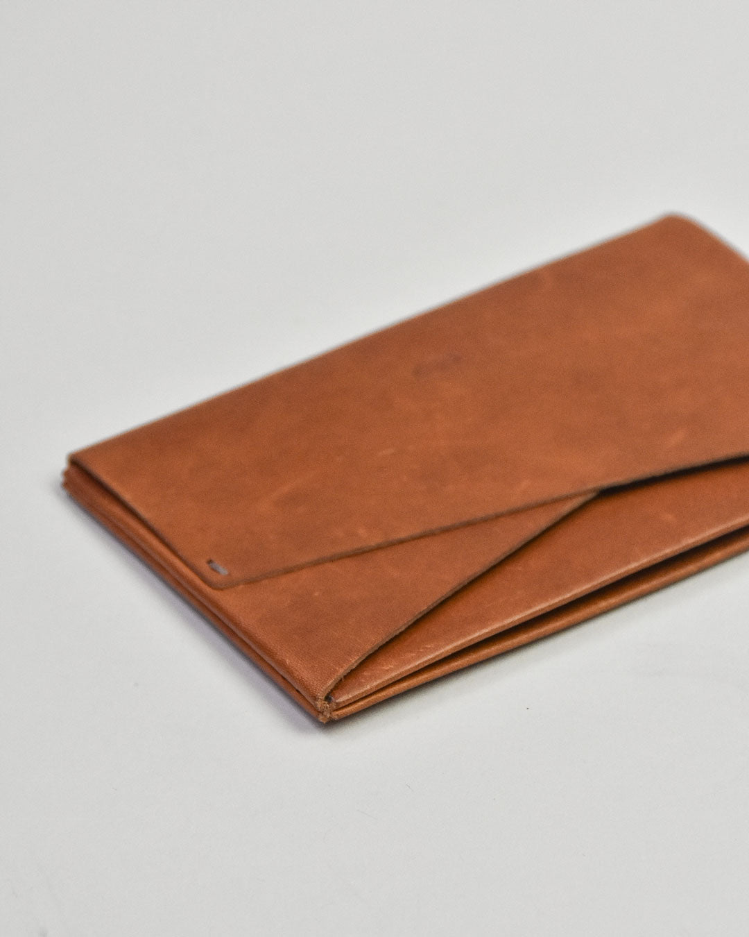 simetrie busyman x simétrie one piece card wallet / tan